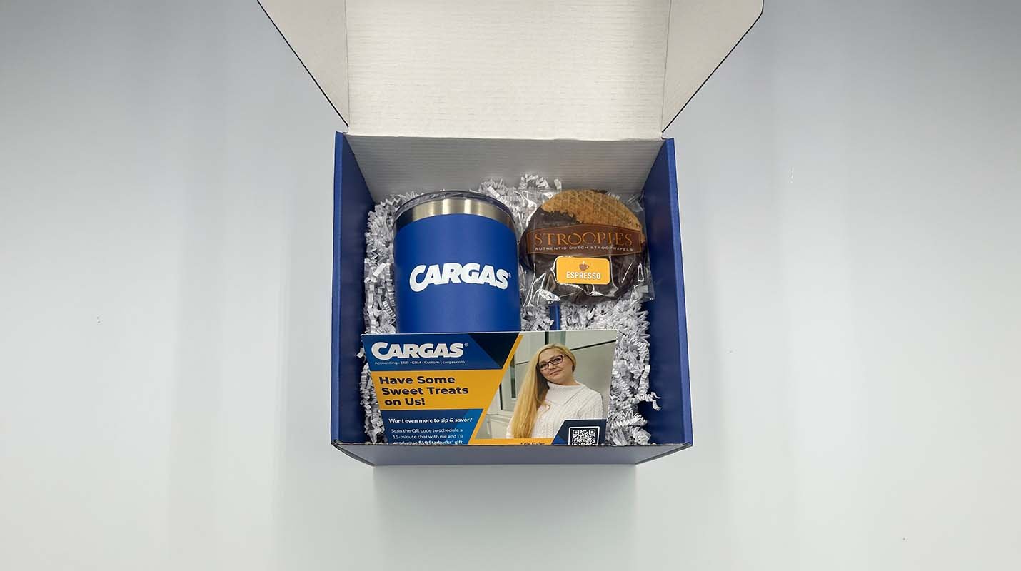 Branded tumbler, Stroopies treat and info card with packaging material inside full-color branded Cargas box