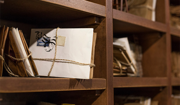 Bundles of unopened mail pieces in their respective boxes