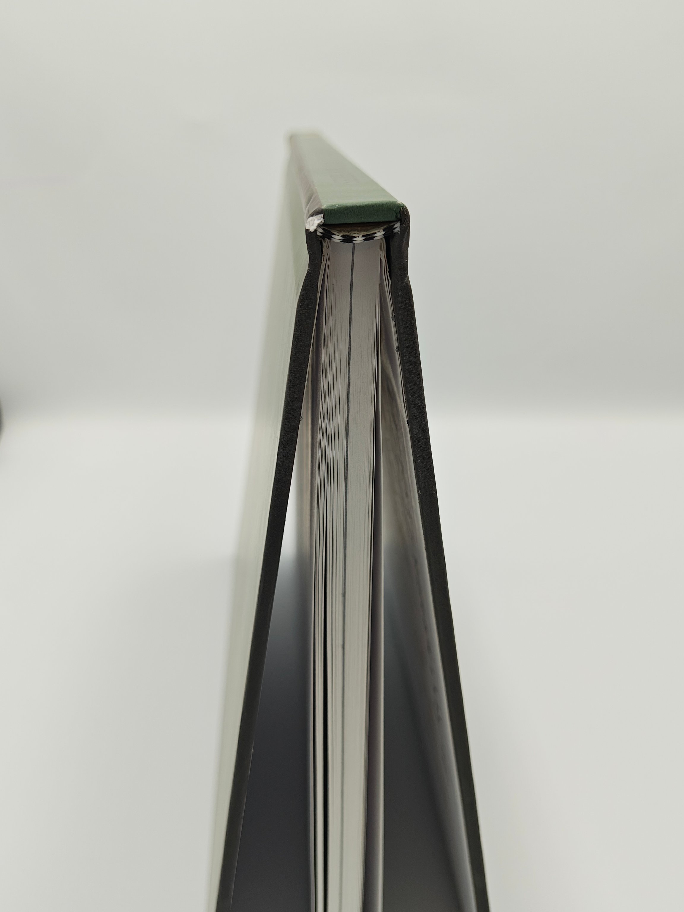 Upright hardcover book showing binding and pages inside