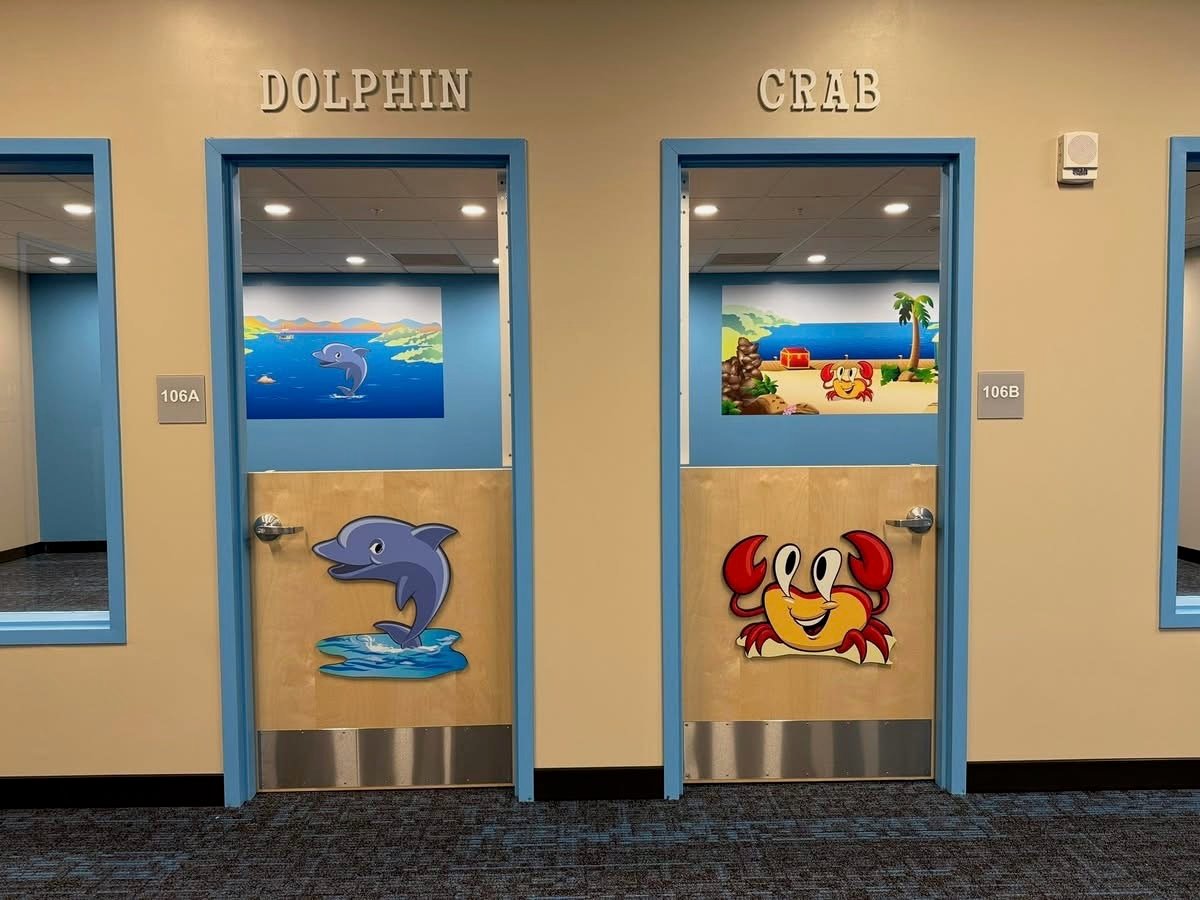 Two doors with decals, crab and dolphin