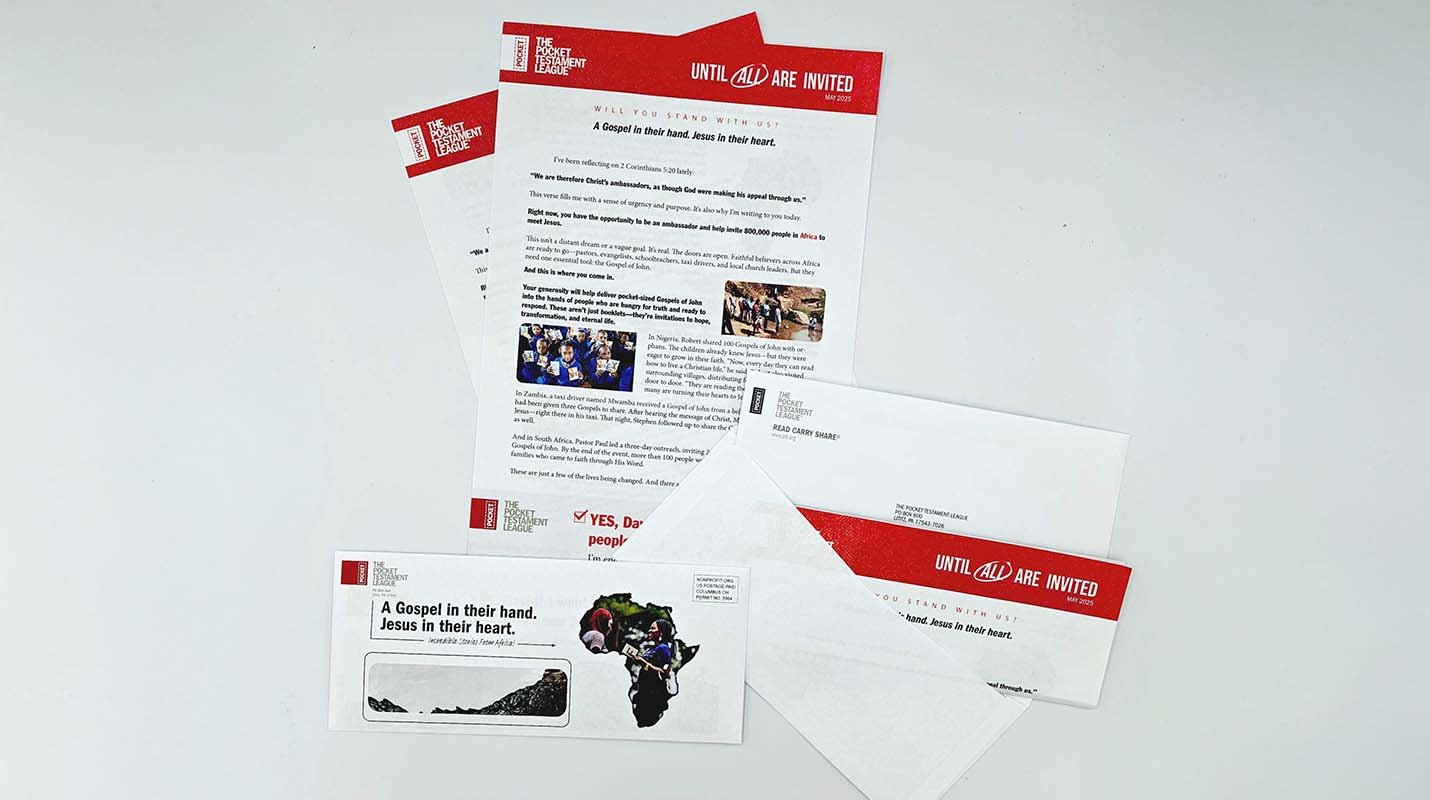Collection of direct mail items with bright red branding, including perforated response slip and return envelope